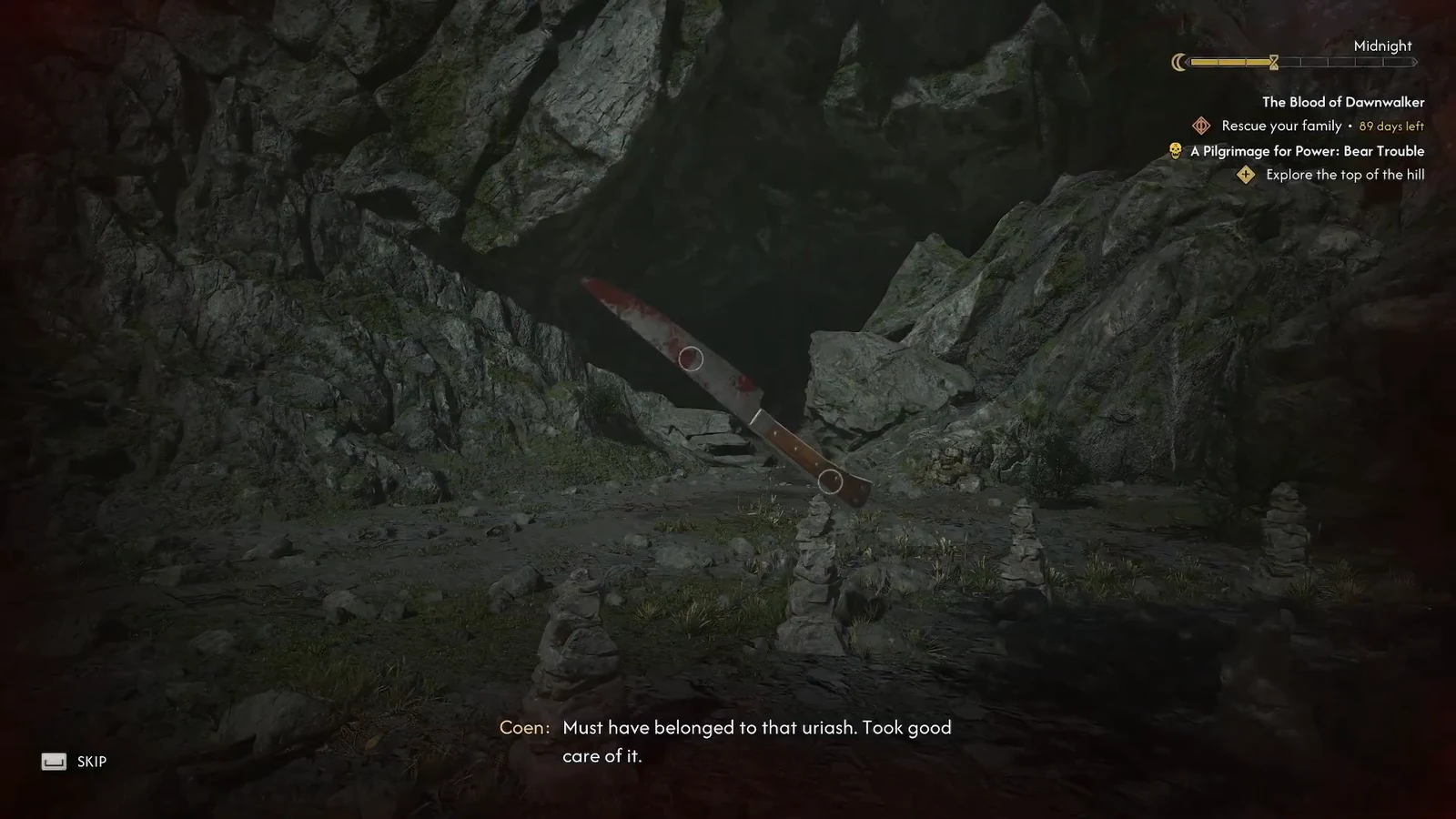 Inspecting the bloody knife on the Bear Trouble summit