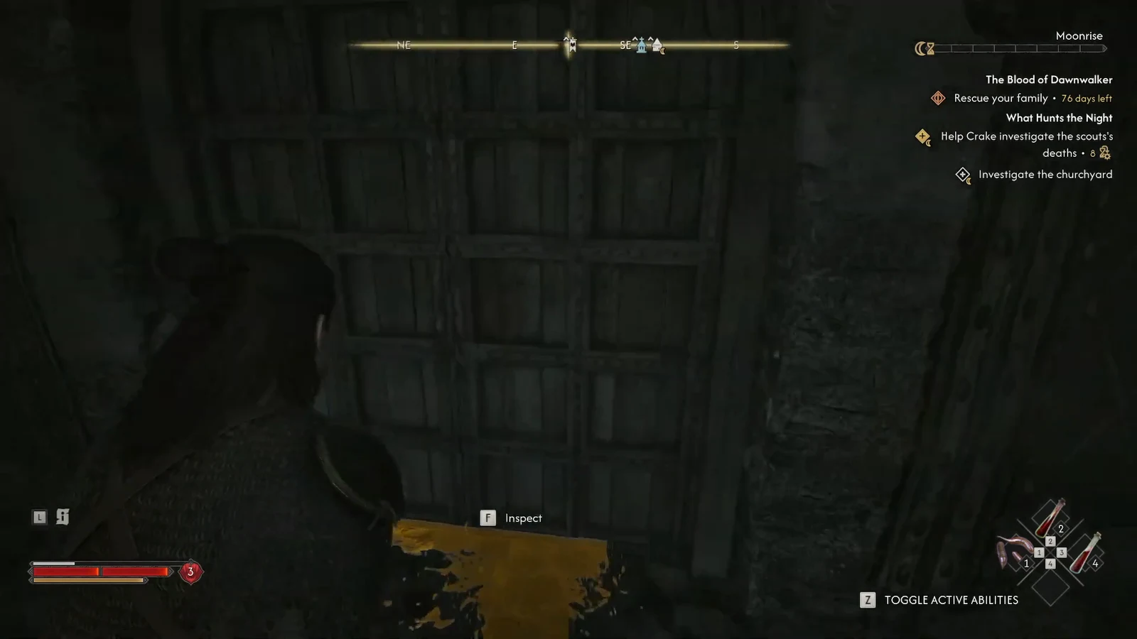 Inspect prompt on the trace before the wooden door.