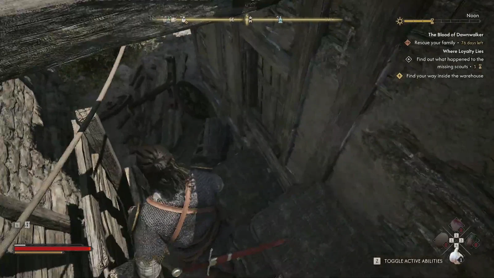 Elevated wooden passage beside the warehouse, with the entry objective active.